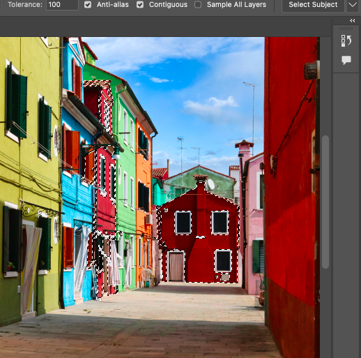 A photo of a colorful street in adobe.