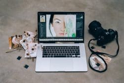 A laptop with a photo of a woman on it.