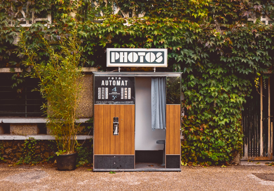 A photo booth in front of a building.