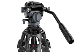 Professional camera tripod with a fluid head and adjustable legs.