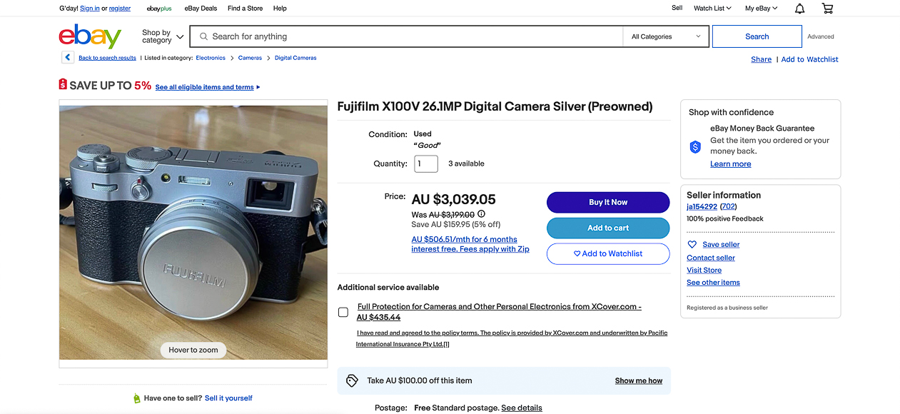 A screenshot of an ebay listing showing a fujifilm x100v 26.1mp digital camera (silver) being sold as pre-owned at a price of au $1,399.00.