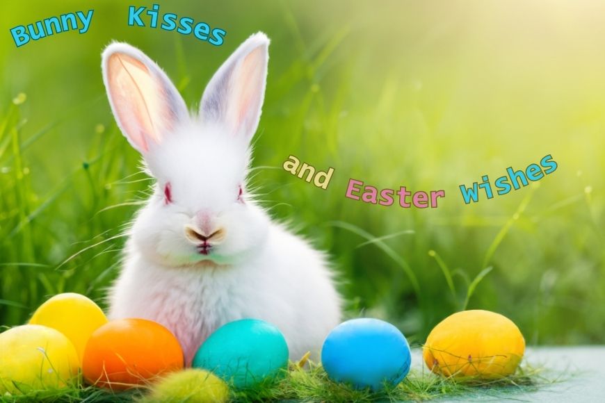 A fluffy white bunny surrounded by colorful easter eggs on a grassy surface with the phrase "bunny kisses and easter wishes" displayed.