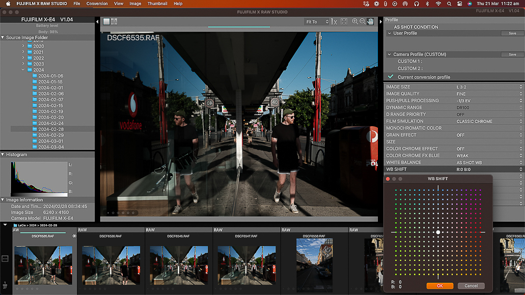 Image editing software interface displaying a street photograph, showing a person walking on a sunny day with city architecture in the background, with various editing tools and settings visible on the screen.