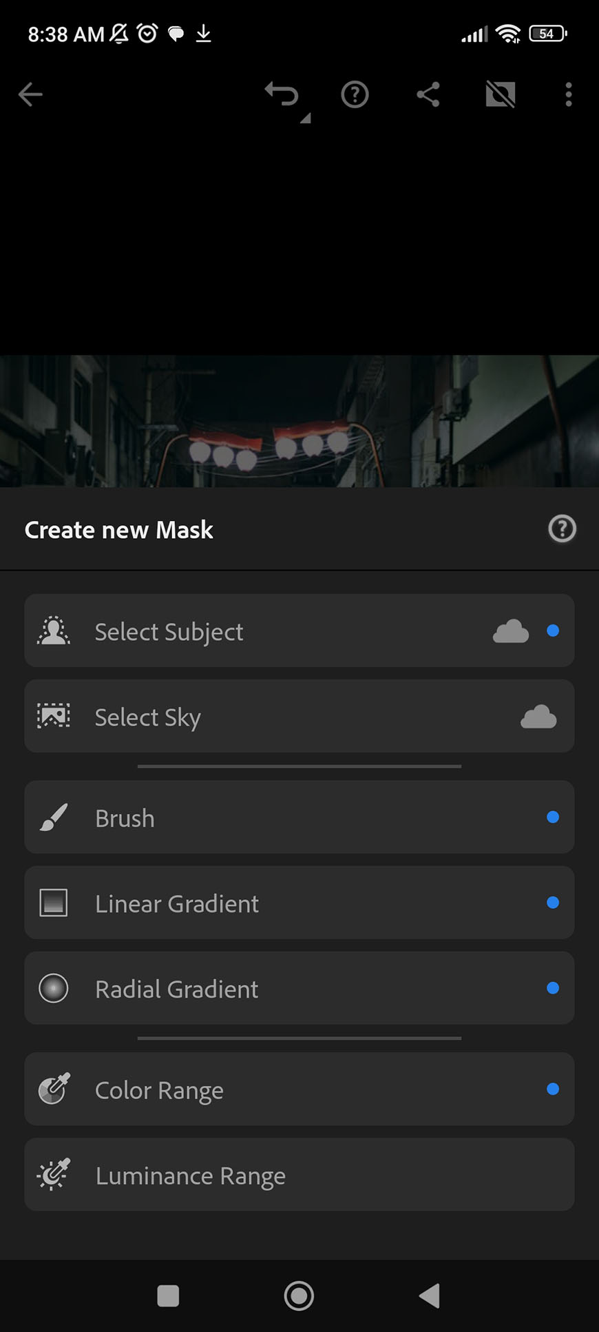 A smartphone screen displaying a photo editing app with various masking tools such as "brush," "linear gradient," and "radial gradient.