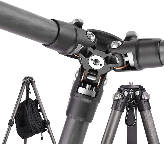 Close-up view of a black tripod showing its three-legged structure and central pivot mechanism with a camera mounting plate, isolated against a white background.