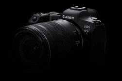 A canon eos r5 camera against a black background.