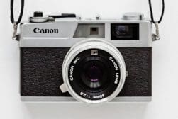 Vintage canon film camera against a white background.