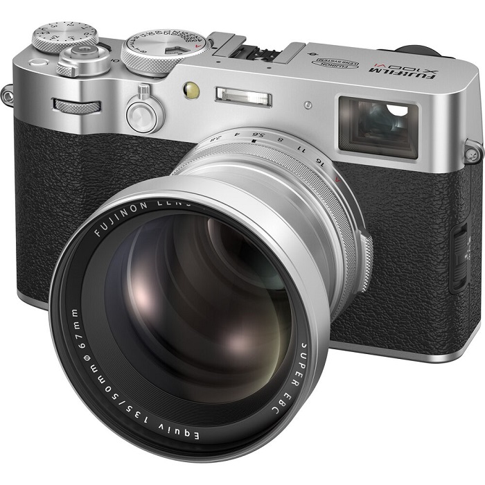 A silver and black mirrorless camera with a large lens and retro design.