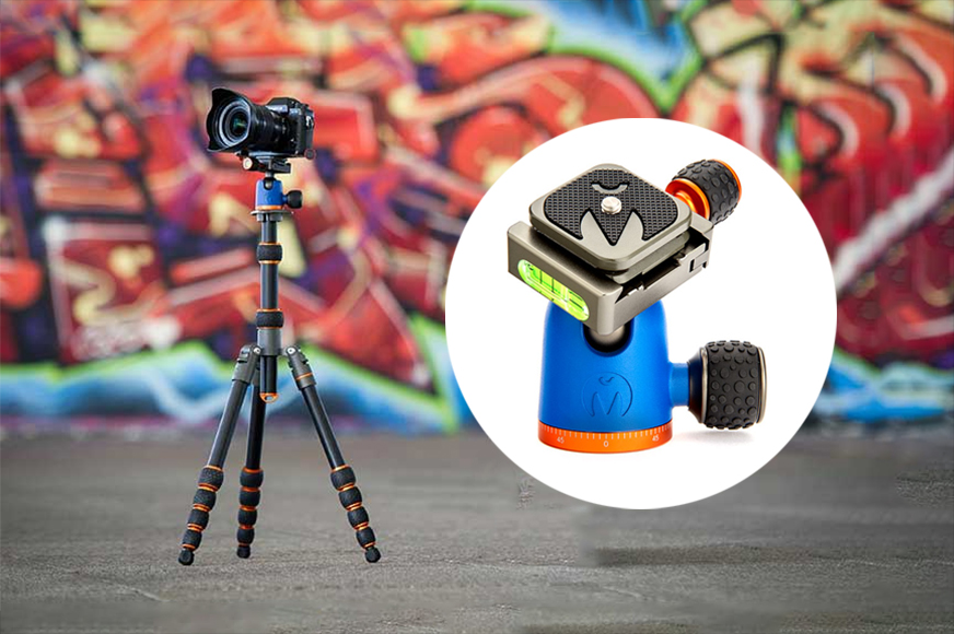 A dslr camera mounted on a tripod with a colorful graffiti wall in the background, alongside an image of a handheld massaging device.