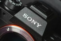 Close-up of a sony camera with an e-mount lens system.
