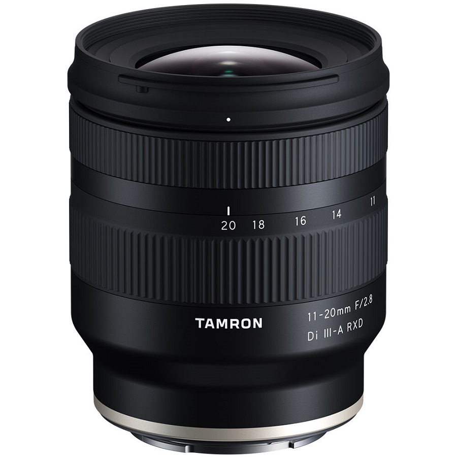 A black tamron camera lens, model 11-20mm f/2.8 di iii-a rxd, with focus and zoom rings, viewed from the side.