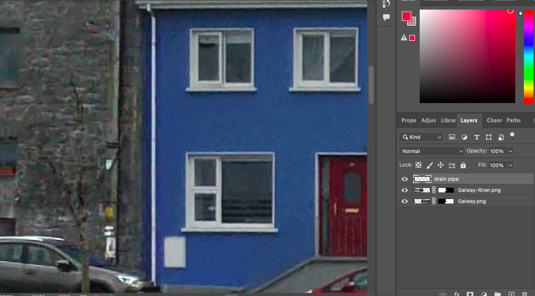 A photo of a blue house in adobe photoshop.