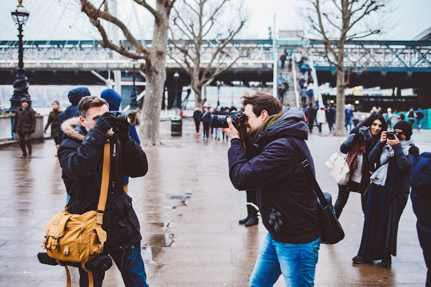 A group of photographers taking pictures in london.