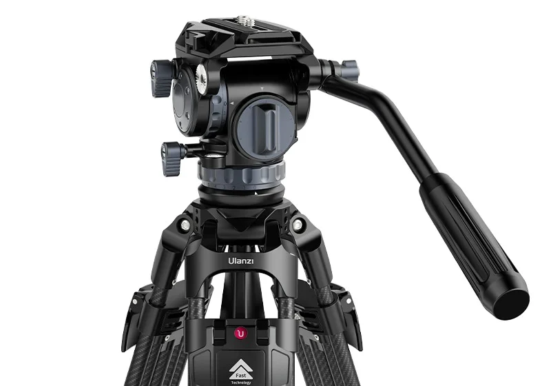 Professional camera tripod with a fluid head and adjustable legs.