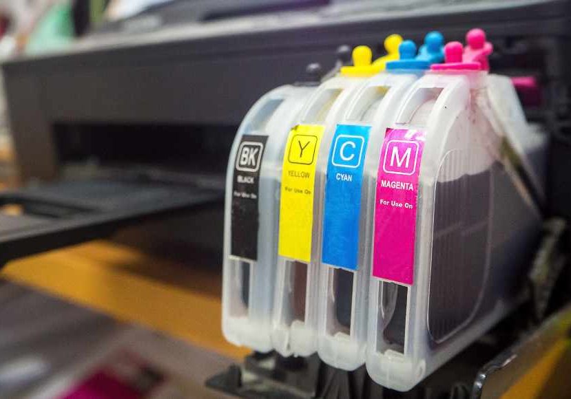 Epson ink cartridges in a printer.