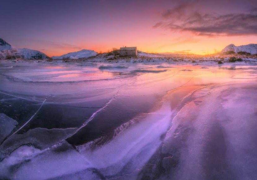 A beautiful sunrise over a frozen lake captured using an FLD filter