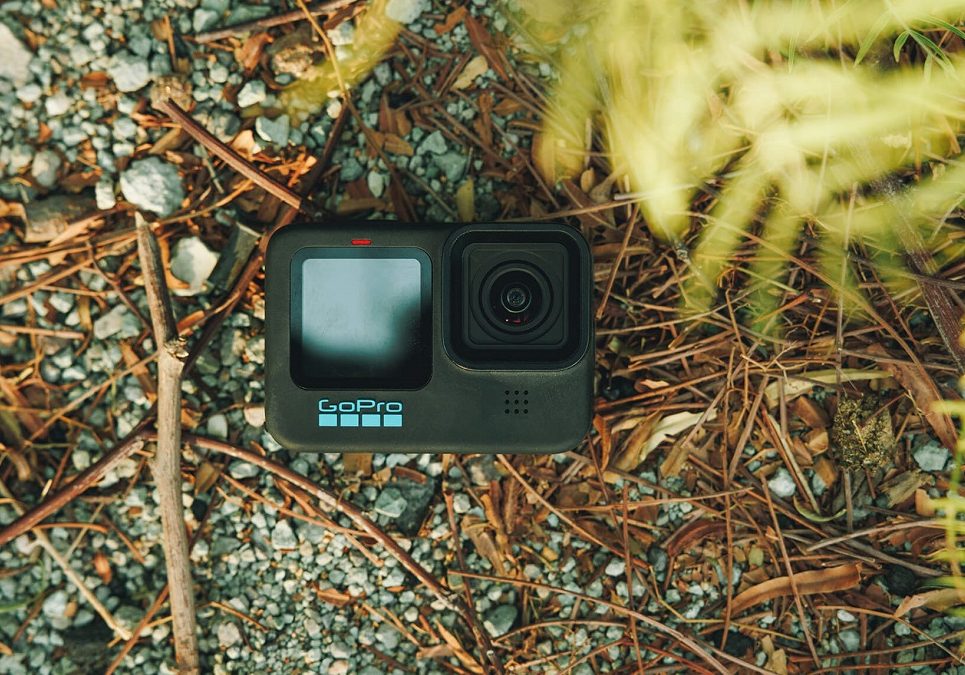 A gopro hero 4 black laying on the ground.