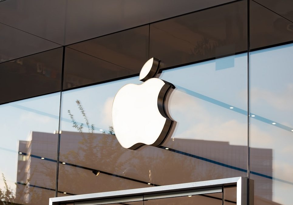 An apple logo is seen on the side of a building.