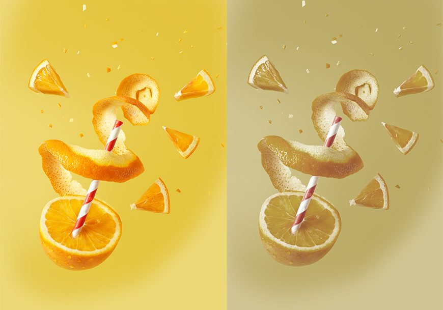 A slice of orange with a straw.
