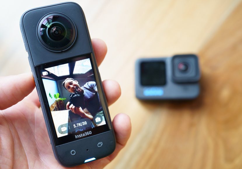 a person holding an insta360 x3 action camera in their hand.