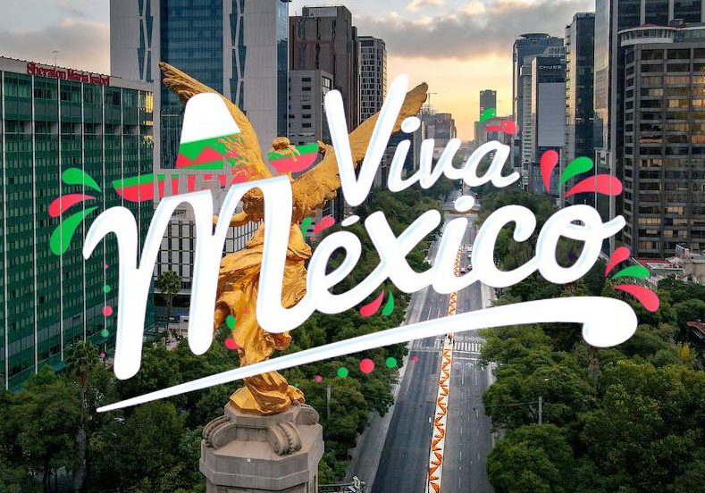 The word 'viva mexico' is in the background of a city.